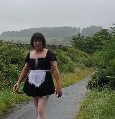 Transvestite young lady in a broach driveway in burnish apply rain